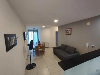 a living room with a couch and a table at Mi Espacio Departamento en Alta Gracia in Alta Gracia