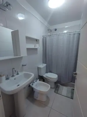 a bathroom with a sink and a toilet and a shower at Mi Espacio Departamento en Alta Gracia in Alta Gracia