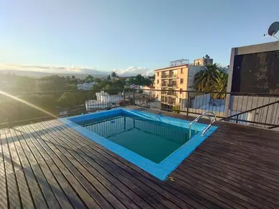 a swimming pool on the roof of a building at Mi Espacio Departamento en Alta Gracia in Alta Gracia