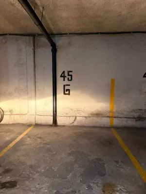a parking garage with numbers on the wall at Departamento 8 Villa Carlos Paz in Villa Carlos Paz