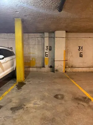 a parking garage with a car parked in it at Departamento 8 Villa Carlos Paz in Villa Carlos Paz