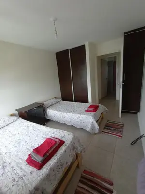 a room with two beds in a room at Home Rio Cuarto 
