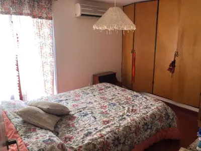 a bedroom with a bed with pillows on it at Casa en Villa del dique con piscina ideal p dos familias in Villa del Dique