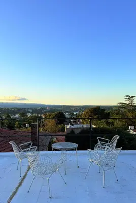 a group of chairs and a table on a patio at Patio Serrano - Casa privada en planta baja in Villa Carlos Paz