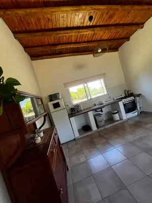 an overhead view of a kitchen with wooden ceilings at Altos de la Quebrada in Quebrada de los Pozos