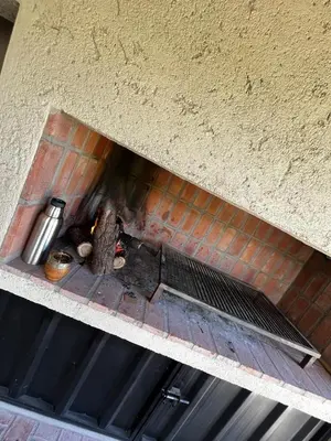 an overhead view of a fire in a brick oven at Altos de la Quebrada in Quebrada de los Pozos