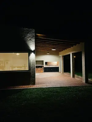 an empty house with a patio at night at Altos de la Quebrada in Quebrada de los Pozos