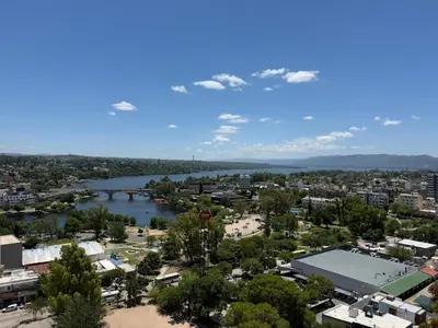 an aerial view of a city and a river at Torre Melos Carlos Paz in Villa Carlos Paz