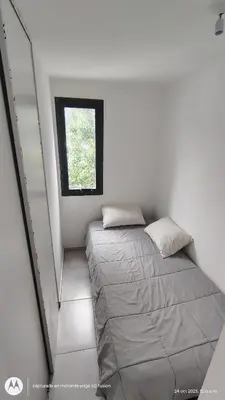 a small bedroom with a bed and a window at Carmen alojamientos in Cordoba