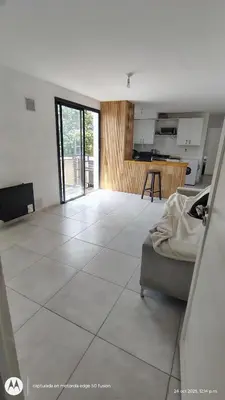 a living room with a large white tile floor at Carmen alojamientos in Cordoba