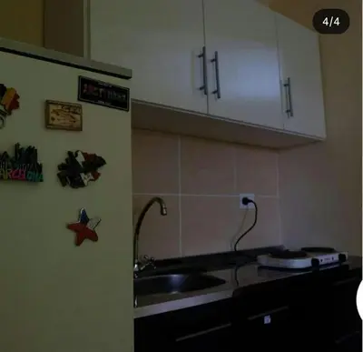 a kitchen with a sink and a counter top at Urquiza 1 in Pilar