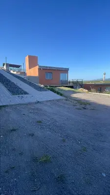 an empty road with a building in the background at Bella Vista in Villa Carlos Paz