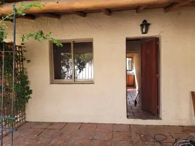 an open door of a house with a window at Fuego in Nono