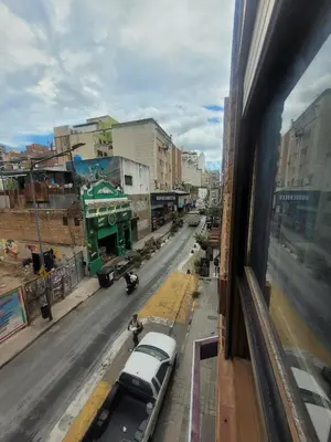 a view from a window of a city street with cars at Departamento RONDEAU, NUEVA CÓRDOBA in Cordoba