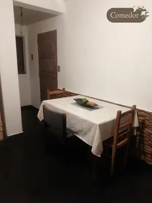 a table with a plate of fruit on top of it at Departamento dos habitaciones en zona tranquila in Cordoba