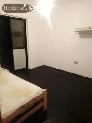 a bedroom with a bed in a room with a window at Departamento dos habitaciones en zona tranquila in Cordoba