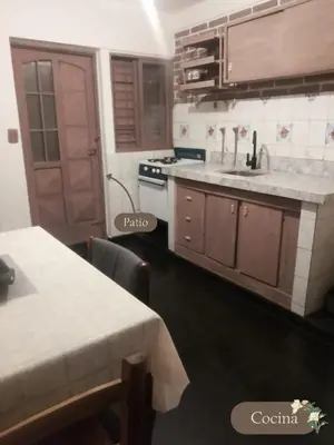 a kitchen with a sink and a counter top at Departamento dos habitaciones en zona tranquila in Cordoba