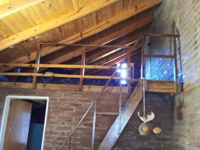 a staircase in a brick building with a window at Xaraba in Villa Parque Siquiman