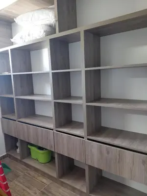 a room with wooden shelves in a bedroom at Mi Destino in Tanti