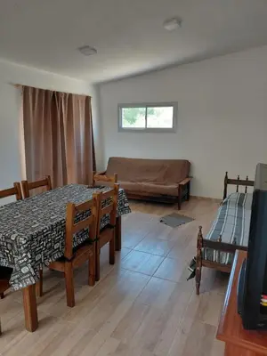 a living room with a table and a couch at Mi Destino in Tanti
