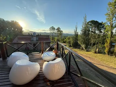 a group of white pots sitting on top of a bridge at Cabañas El Mirador in Alpa Corral