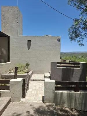 a concrete building with a wall at El Mirador de la Finca in Cavalango
