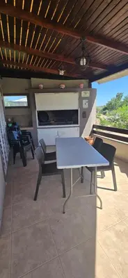 a white table and chairs on a patio at El Mirador de la Finca in Cavalango