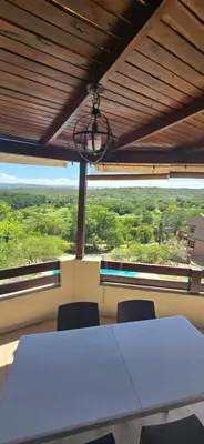 a meeting room with a table and chairs and a window at El Mirador de la Finca in Cavalango