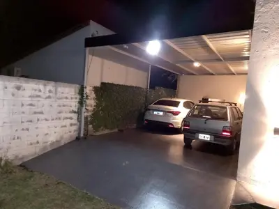 two cars parked in a garage at night at El Campito in San Antonio de Arredondo