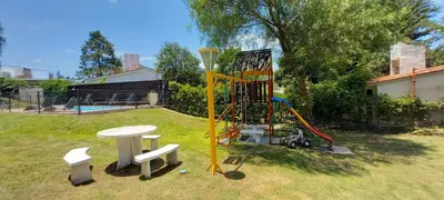 a playground in a yard with a table at El Campito in San Antonio de Arredondo