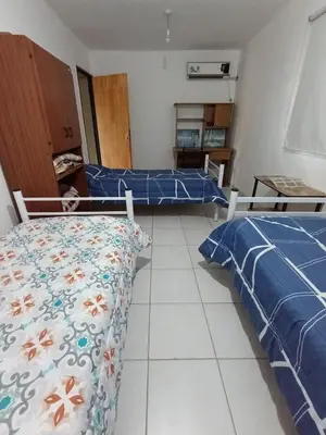 two beds in a room with blue and white at Solo empresas mensual in Pilar