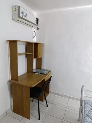 a wooden desk in a room with a bed at Solo empresas mensual in Pilar
