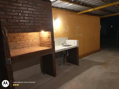a bathroom with a sink and a brick wall at Nuestro sol-ar in Tanti