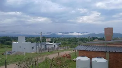 a building with two water tanks in front of it at Nuestro sol-ar in Tanti