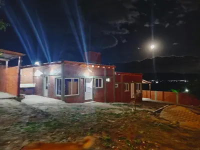 a small house at night with a street light at Nuestro sol-ar in Tanti