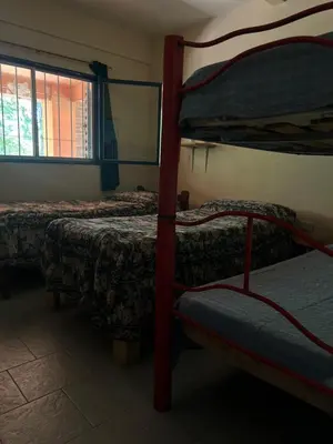 a room with two bunk beds and a window at Mar y Mar in La Estancia