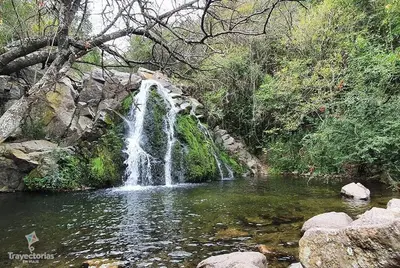 a waterfall in the middle of a river at Emilia Casa de Campo in Santa Rosa de Calamuchita