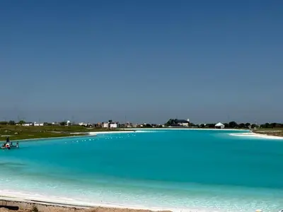 a large body of water with a boat in it at HOUSE SOUTH en AQUAVISTA VILLA RESIDENCIAL in Malagueño