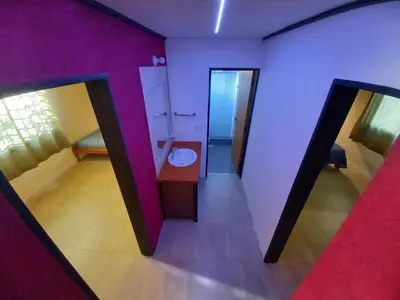 a bathroom with a sink and a toilet in a room at Casita los ceibos in Villa Santa Cruz del Lago