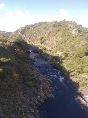 a view of a river with a mountain at La tranquera ll in Trapiche