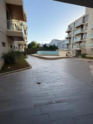 an empty parking lot in front of some buildings at Departamento en Villa Carlos Paz in Villa Carlos Paz