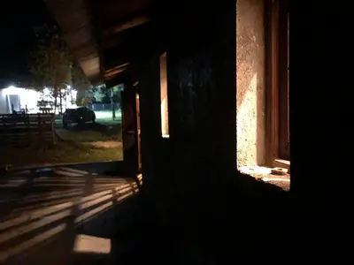 a shadow of a building with a window at night at Los árboles in Cordoba