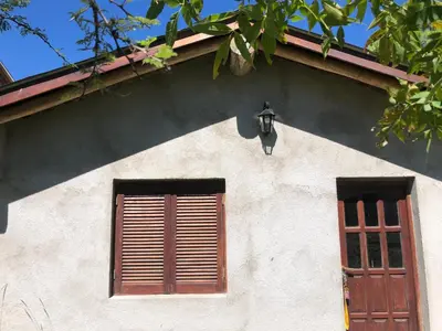 a building with a window and a lamp on it at Los árboles in Cordoba