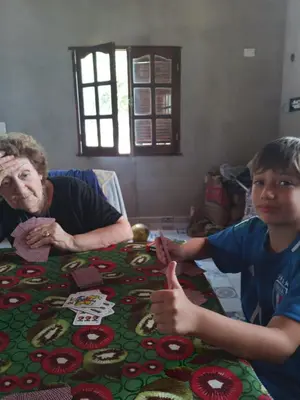 a man and a young boy sitting at a table with a christmas table at Los árboles in Cordoba