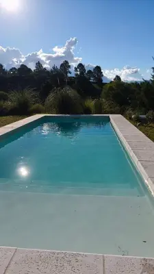 a large swimming pool with a clear blue at Aire in La Estancia