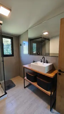 a large bathroom with a sink and a mirror at Aire in La Estancia