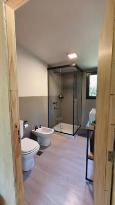 a bathroom with two toilets and a shower at Aire in La Estancia