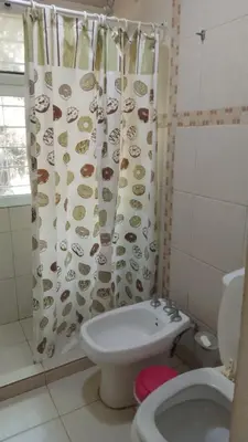 a bathroom with a toilet and a shower curtain at Casa Nacha in Cuesta Blanca