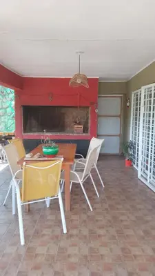 a dining room with a table and chairs at Casa Nacha in Cuesta Blanca
