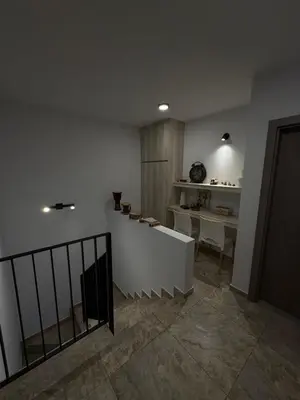 a room with a staircase with a table and a desk at Estilo y Relax en Manantiales ll in Cordoba